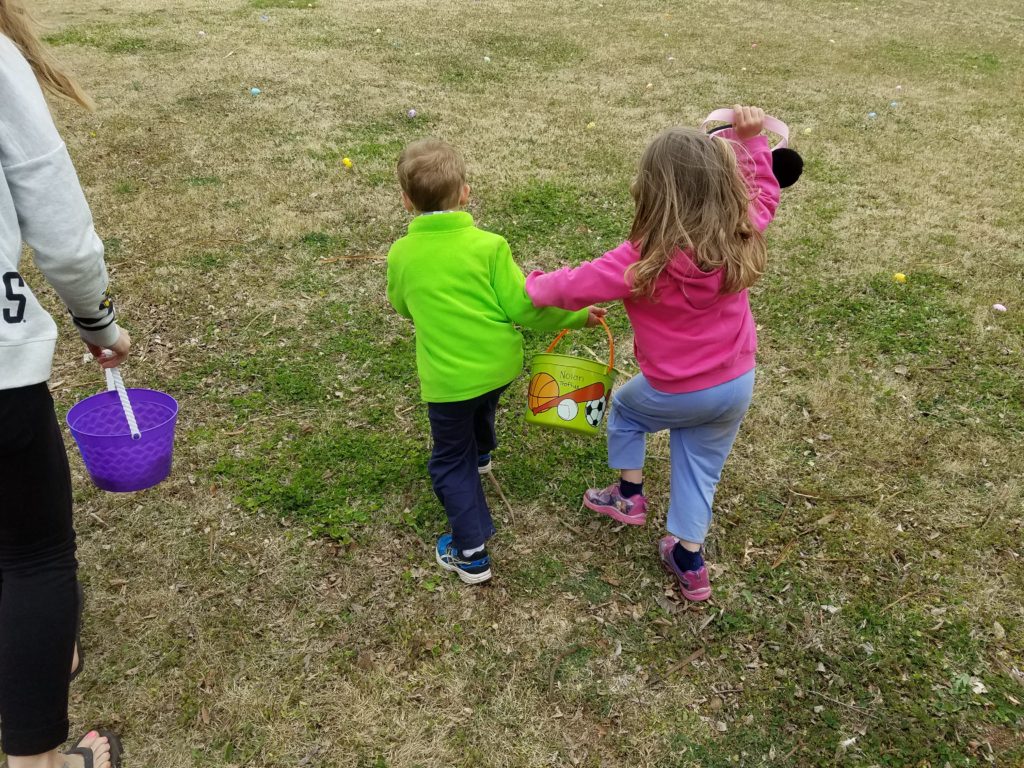 Nolan boxing out his cousin at the Easter egg hunt