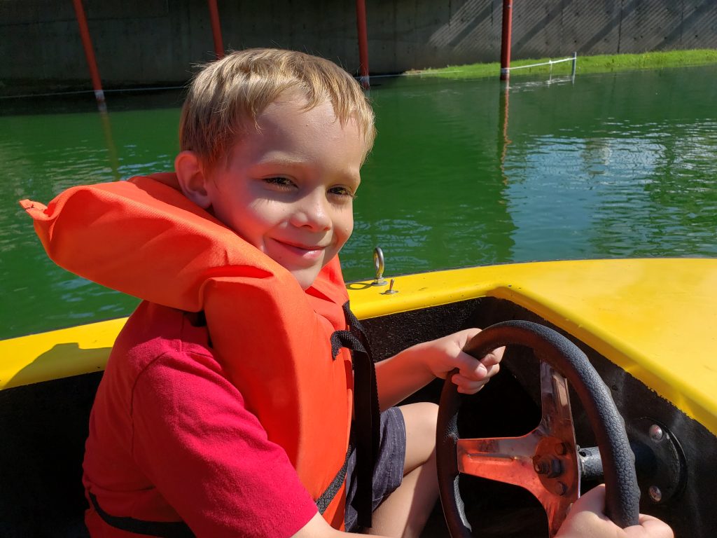 Nolan driving the boat